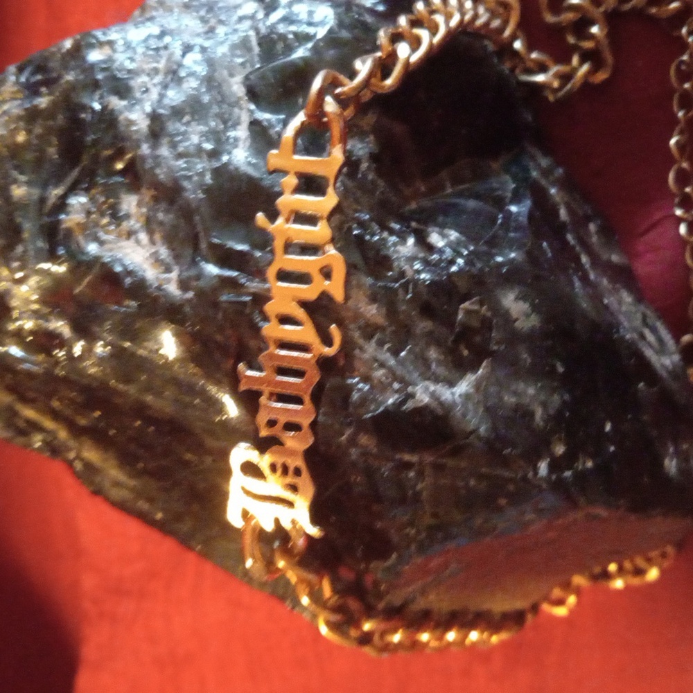 Babygirl gold tone choker necklace.